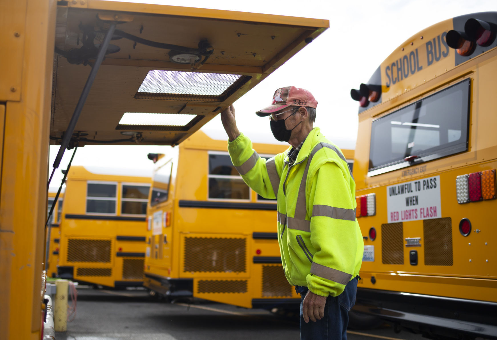 Bob Wilson inspects his bus